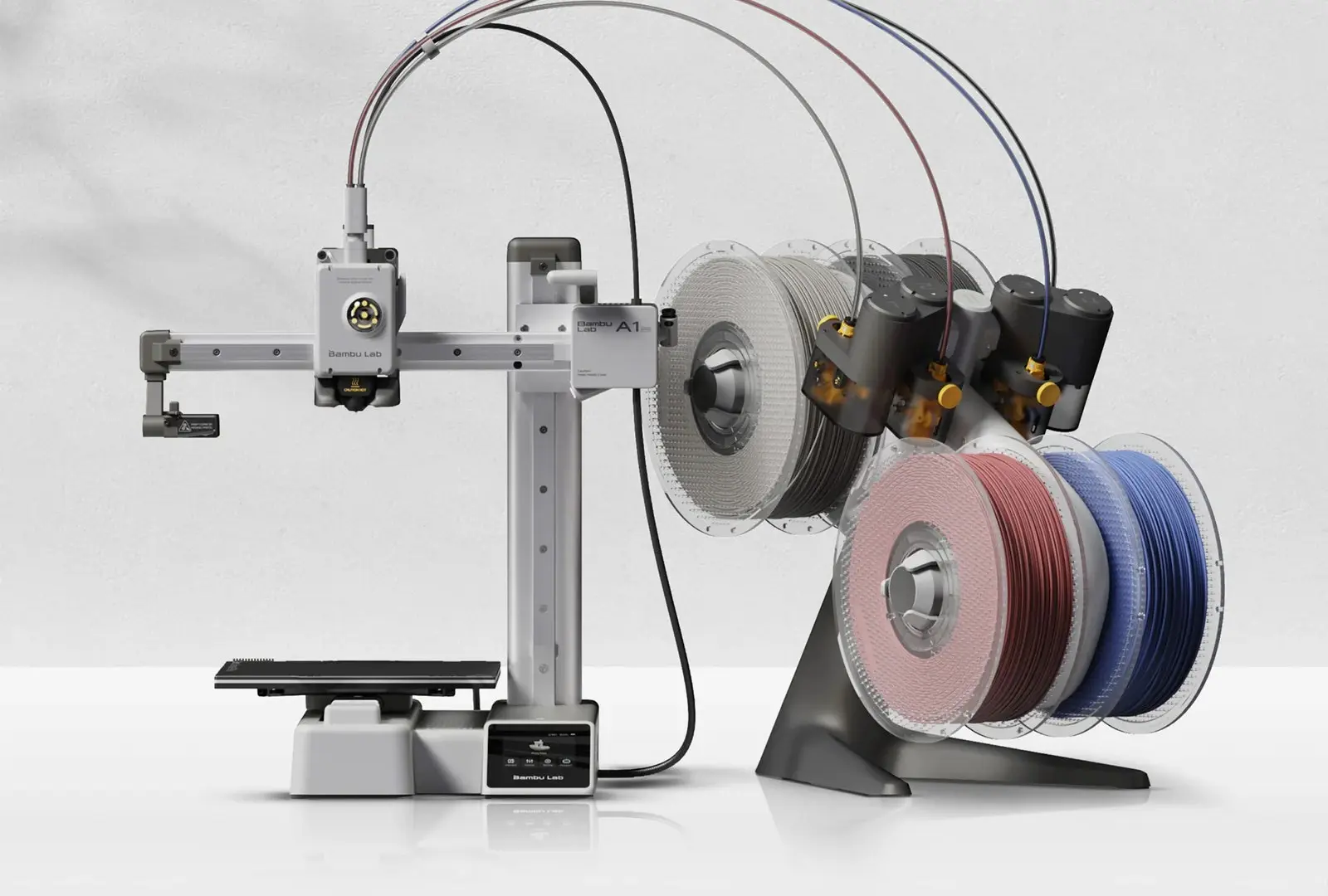 Bambu Lab A1 Mini Combo 3D printer with four filament spools