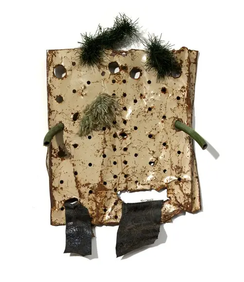 Untitled (1985), a scarecrow assemblage of cut sheet metal and found objects.