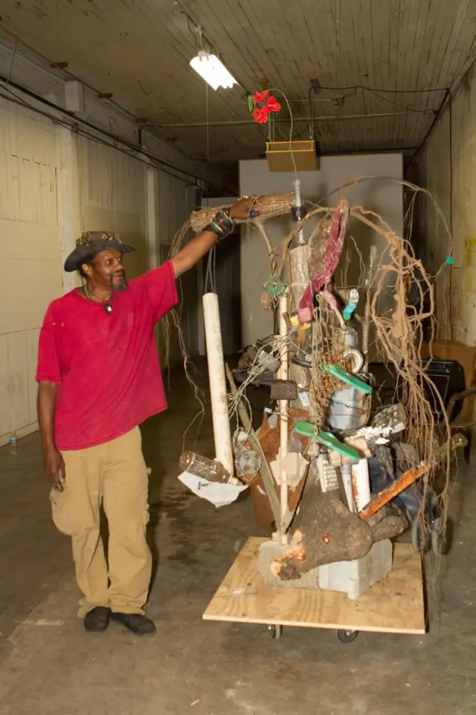 Lonnie Holley with one of his found object sculptures.