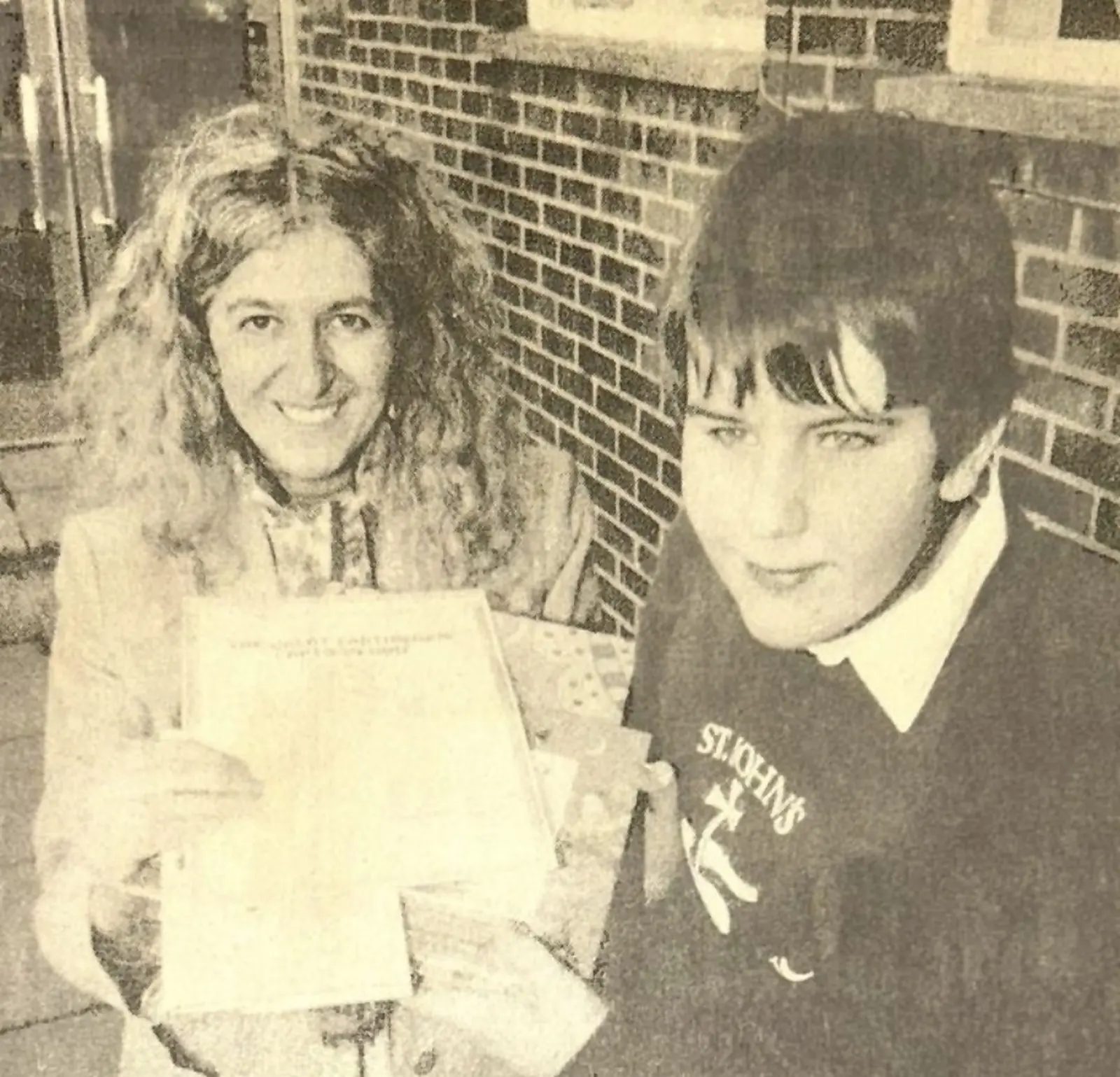 1993: eleven-year-old Steven Light in his St John's School Marlborough jumper receives his Friends of the Earth Earthworm Cartoon Quiz prize from Jean Saunders