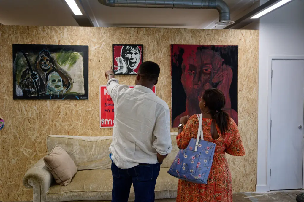 Guests viewing artwork in the exhibition space