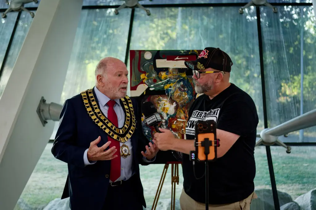 A visitor in conversation with the Mayor of Swindon