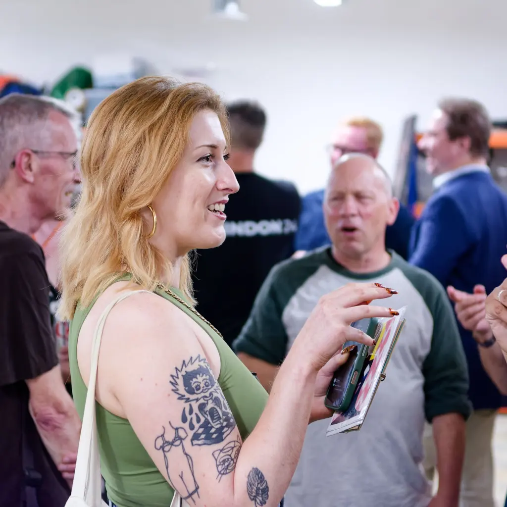A guest in conversation at the exhibition