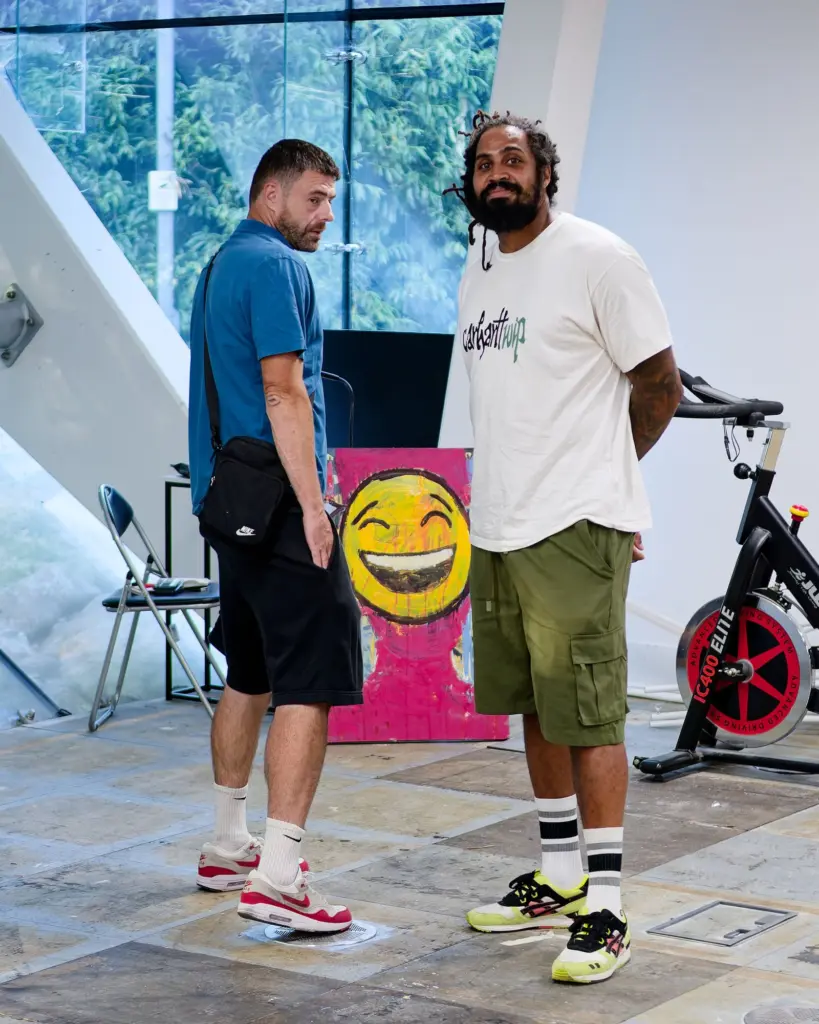 Swindon graffiti artists Jaksta and Ramone in front of SLART artwork