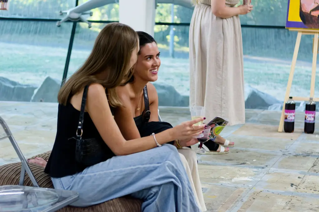 A guest seated by the studio window