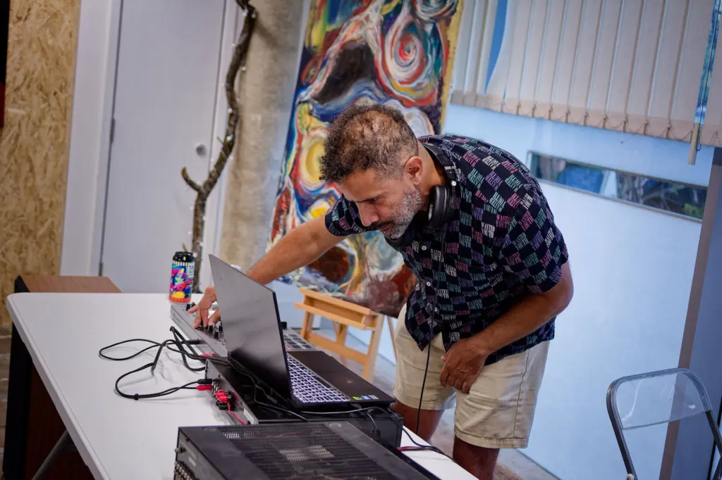 A guest studying an artwork closely