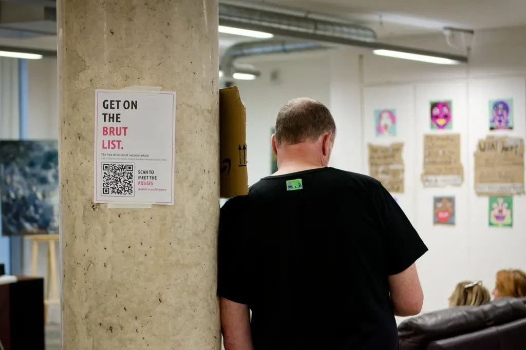 A guest beside the "Get on the BRUT List" poster