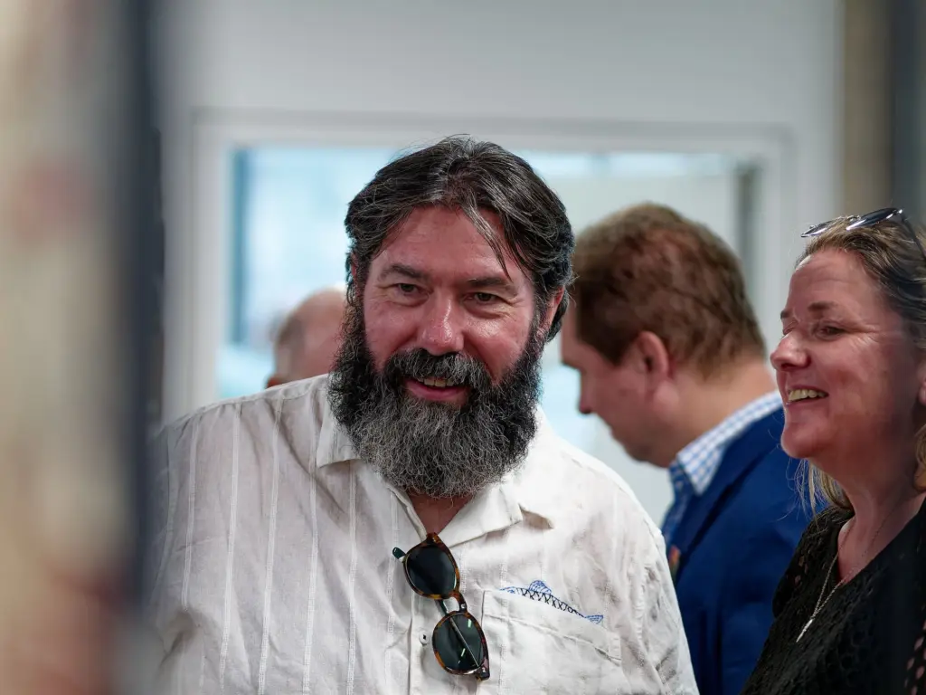 Guests talking and laughing at the opening night