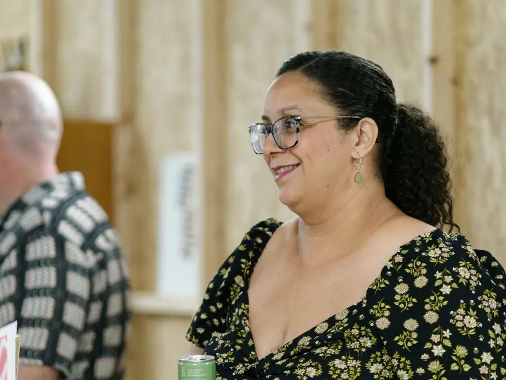 A guest smiling in the exhibition space